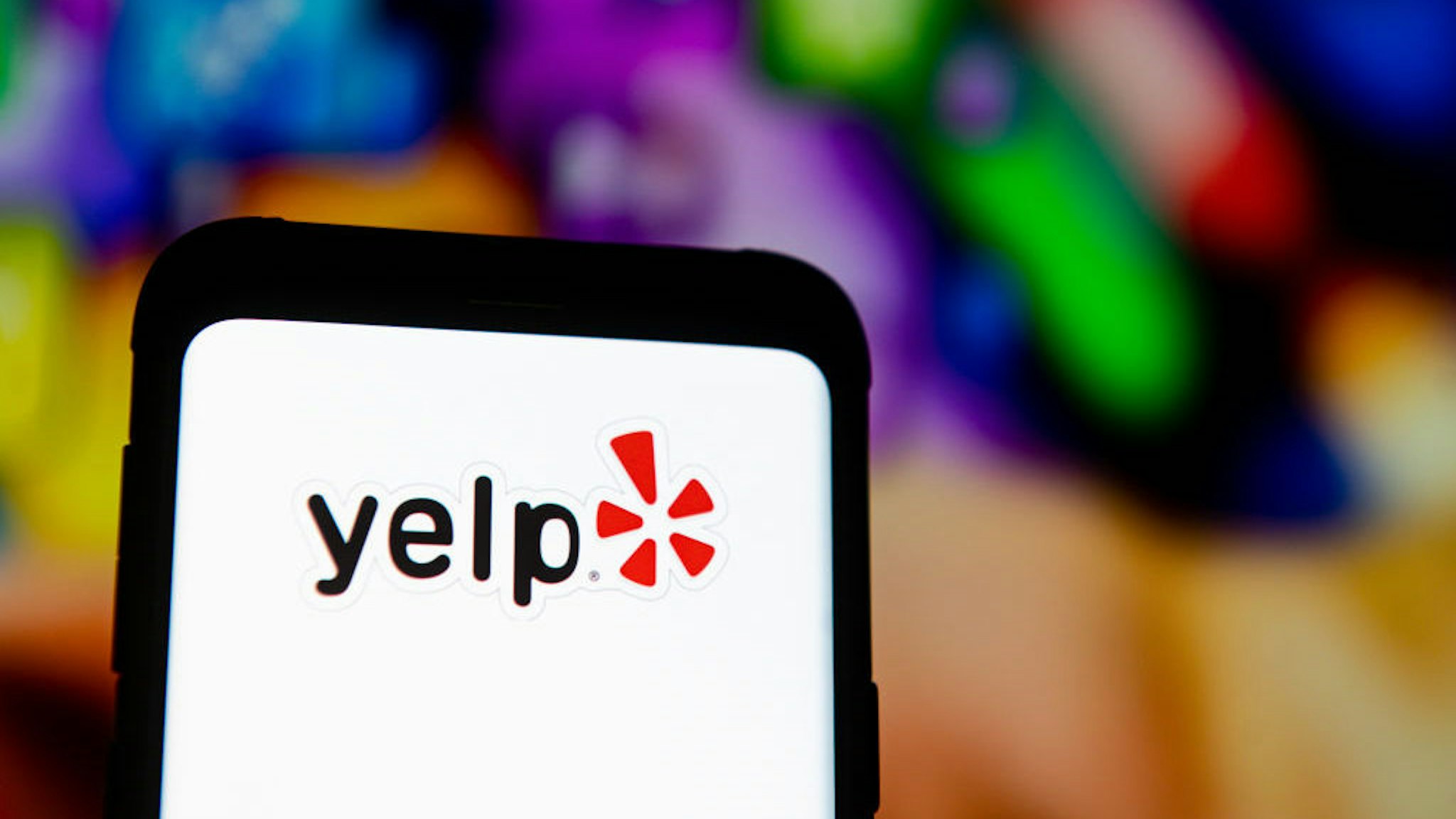 In this photo illustration a Yelp logo seen displayed on a smartphone. (Photo Illustration by Mateusz Slodkowski/SOPA Images/LightRocket via Getty Images)