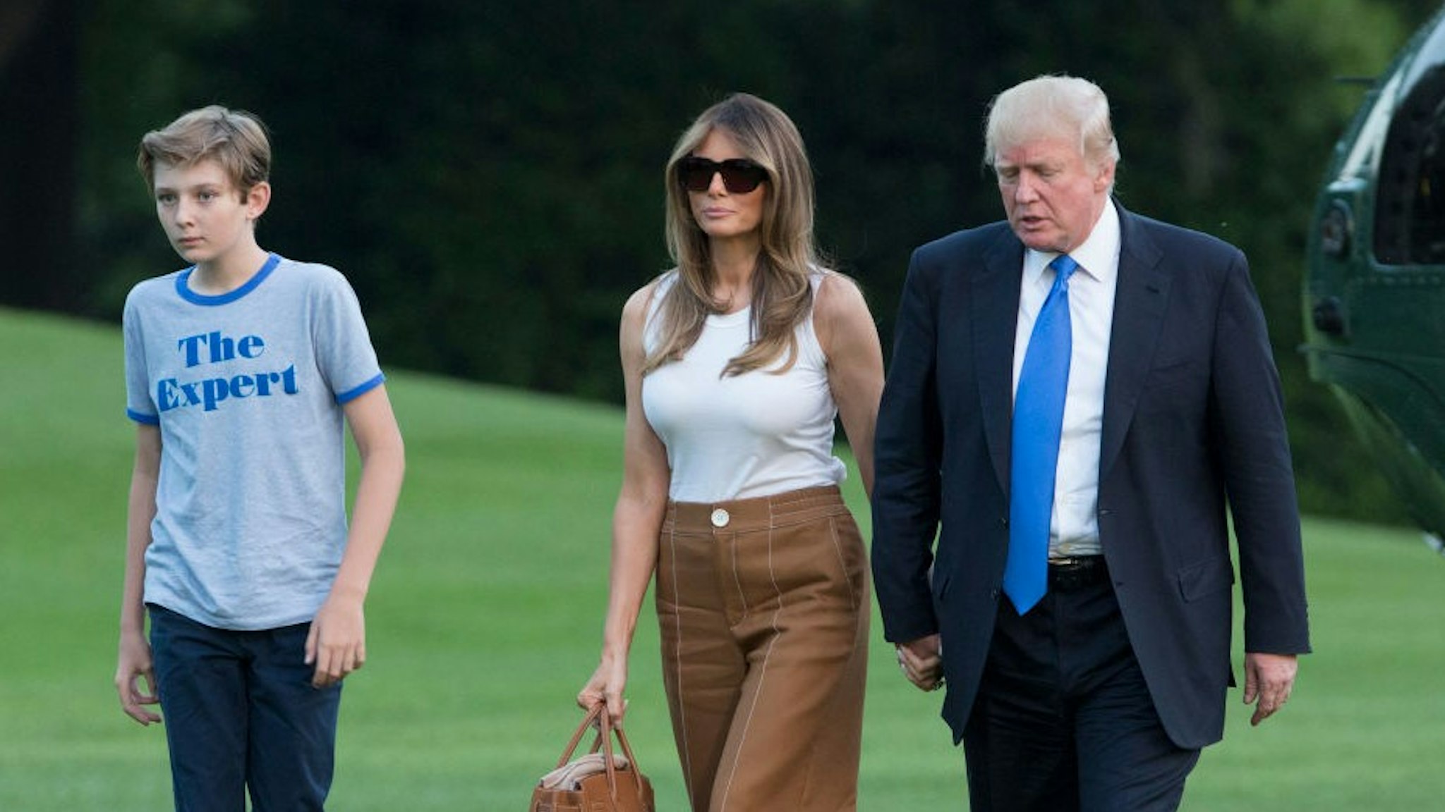 WASHINGTON, D.C. - JUNE 11: (AFP-OUT) U.S. President Donald Trump, first lady Melania Trump and their son Barron Trump arrive at the White House June 11, 2017 in Washington, DC. According to reports, Melania and Barron will soon be moving from Trump Tower in New York City to the White House. (Photo by