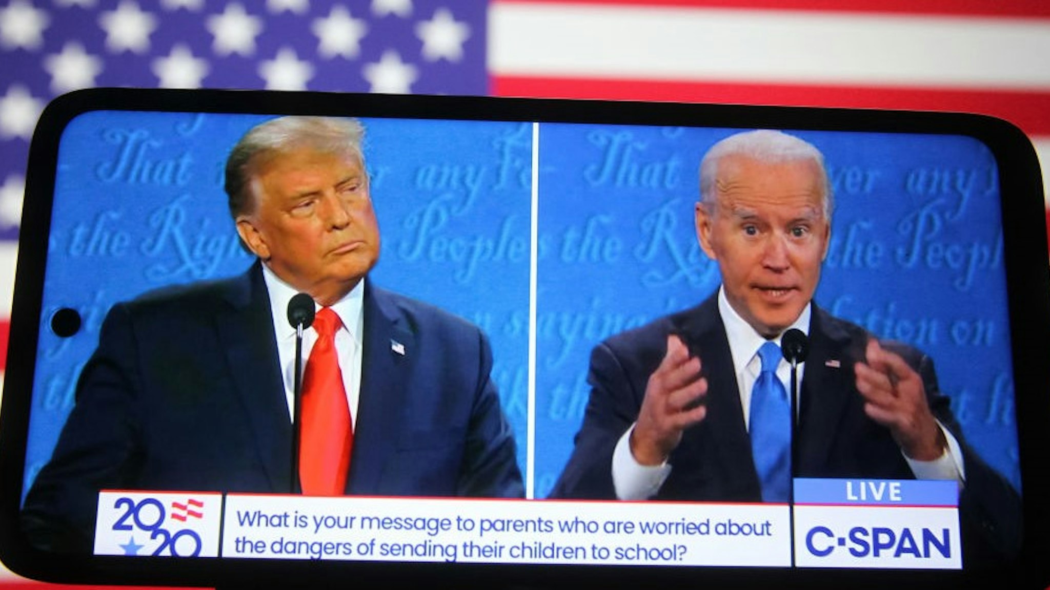UKRAINE - 2020/10/23: In this photo illustration the US President Donald Trump and Democratic presidential candidate and former US Vice President Joe Biden are seen during the final presidential debate displayed on a screen of a smartphone. The final presidential debate between President Donald Trump and former Vice President Joe Biden took place at Belmont University in Nashville, the U.S. on Thursday, October 22. United States presidential election scheduled for November 3, 2020. (Photo Illustration by