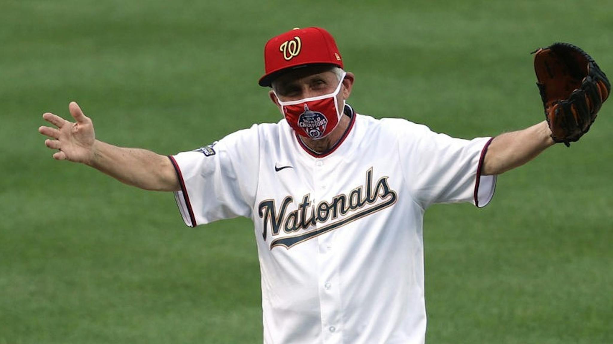 New York Yankees v Washington Nationals WASHINGTON, DC - JULY 23: Dr. Anthony Fauci, director of the National Institute of Allergy and Infectious Diseases reacts after throwing out the ceremonial first pitch prior to the game between the New York Yankees and the Washington Nationals at Nationals Park on July 23, 2020 in Washington, DC. (Photo by
