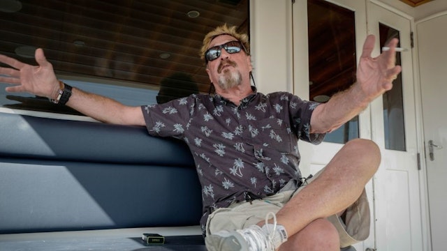 US millionaire John McAfee gestures during an interview with AFP on his yacht anchored at the Marina Hemingway in Havana, on June 26, 2019. - After making his fortune with antivirus software, McAfee fled from Belize after a murder case. (Photo by Adalberto ROQUE / AFP) (Photo credit should read