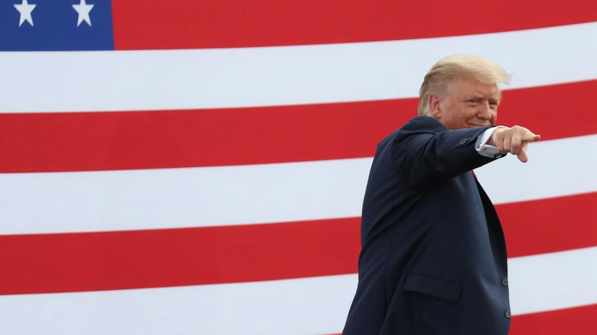 President Trump Delivers Remarks At Jupiter, FL Lighthouse JUPITER, FLORIDA - SEPTEMBER 08: President Donald Trump gestures as he leaves after speaking about the environment during a stop at the Jupiter Inlet Lighthouse on September 08, 2020 in Jupiter, Florida. President Trump announced an expansion of a ban on offshore drilling and highlighted conservation projects in Florida. President Trump faces off against Democratic presidential candidate Joe Biden for the presidency. (Photo by