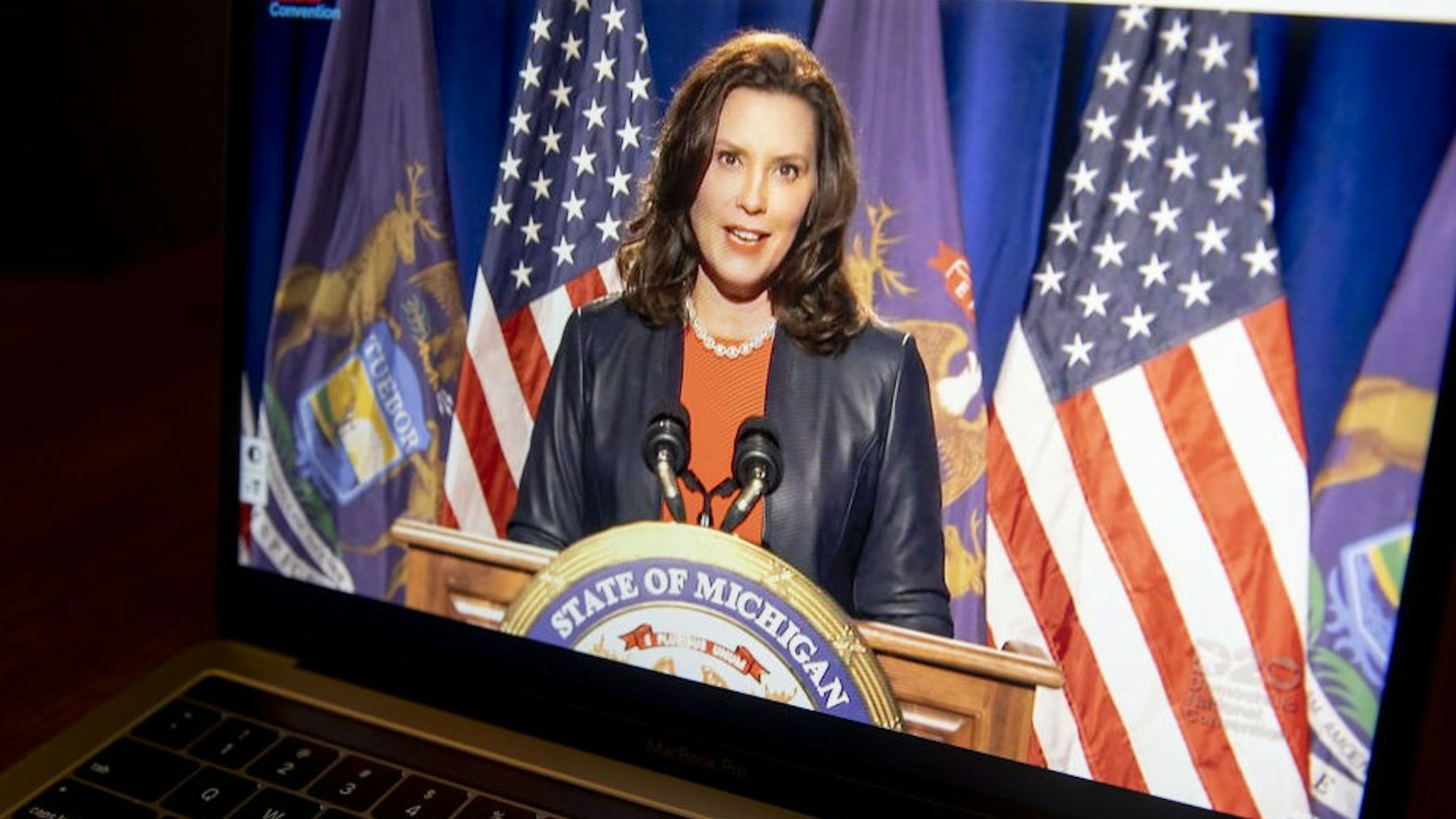 Gretchen Whitmer, governor of Michigan, speaks during the virtual Democratic National Convention seen on a laptop computer in Tiskilwa, Illinois, U.S., on Monday, Aug. 17, 2020. The DNC, which begins today and ends Thursday with Joe Biden accepting the nomination for president, will be almost entirely virtual with speakers delivering addresses from around the U.S. that will be streamed on the internet. Photographer: