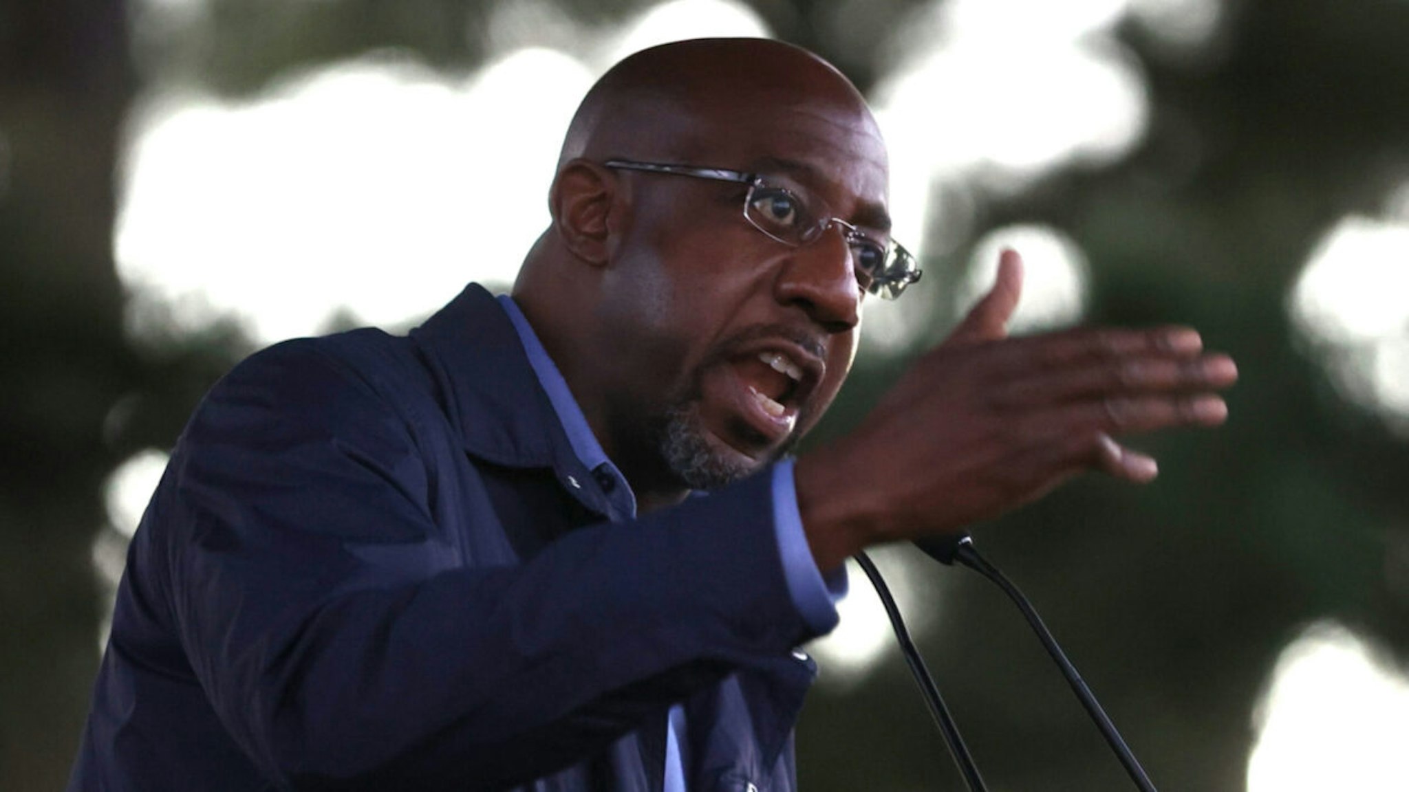 Democratic U.S. Senate candidate Rev. Raphael Warnock speaks during a "Get Out the Early Vote" drive-in campaign event on October 29, 2020 in Columbus, Georgia.