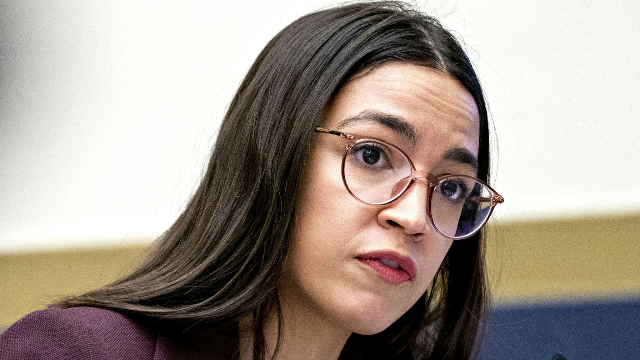 Representative Alexandria Ocasio-Cortez, a Democrat from New York, questions Steven Mnuchin, U.S. Treasury secretary, not pictured, during a House Financial Services Committee hearing in Washington, D.C., U.S., on Thursday, Dec. 5, 2019. Mnuchin said he and the Federal Reserve Chairman dont expect the U.S. to create a digital currency.