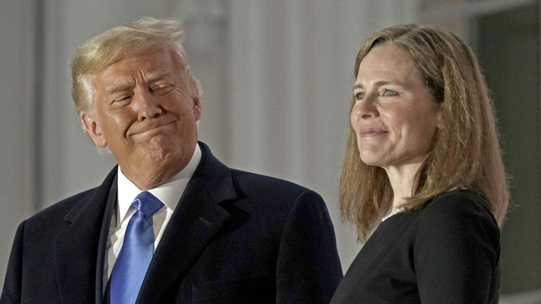Bloomberg Best Of U.S. President Donald Trump 2017 - 2020: U.S. President Donald Trump, left, and Amy Coney Barrett, associate justice of the U.S. Supreme Court, stand on a balcony during a ceremony on the South Lawn of the White House in Washington, D.C., U.S., on Monday, Oct. 26, 2020. Our editors select the best archive images looking back at Trump’s 4 year term from 2017 - 2020. Photographer: Ken Cedeno/CNP/Bloomberg