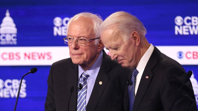 CHARLESTON, SOUTH CAROLINA - FEBRUARY 25: Democratic presidential candidates Sen. Bernie Sanders (I-VT) and former Vice President Joe Biden speak during a break at the Democratic presidential primary debate at the Charleston Gaillard Center on February 25, 2020 in Charleston, South Carolina. Seven candidates qualified for the debate, hosted by CBS News and Congressional Black Caucus Institute, ahead of South Carolina’s primary in four days.