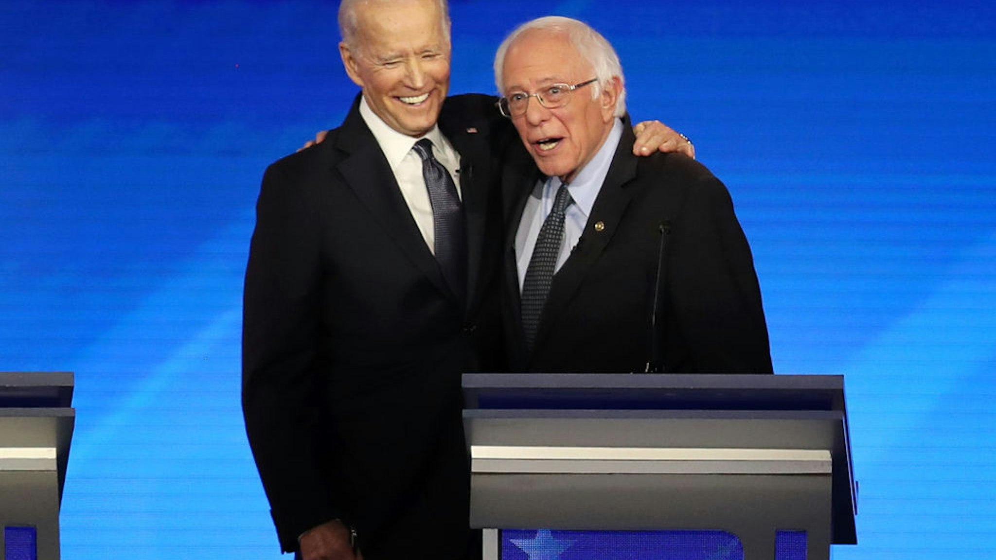 MANCHESTER, NEW HAMPSHIRE - FEBRUARY 07: (L-R) Democratic presidential candidates former Vice President Joe Biden and Sen. Bernie Sanders (I-VT) share a moment during the Democratic presidential primary debate in the Sullivan Arena at St. Anselm College on February 07, 2020 in Manchester, New Hampshire. Seven candidates qualified for the second Democratic presidential primary debate of 2020 which comes just days before the New Hampshire primary on February 11. (Photo by Joe Raedle/Getty Images)