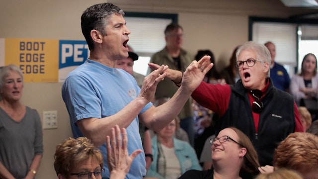 FORT DODGE, IOWA - APRIL 16: A woman shouts down a man making anti-gay remarks as Democratic presidential candidate and South Bend, Indiana Mayor Pete Buttigieg was hosting a town hall meeting at the Lions Den on April 16, 2019 in Fort Dodge, Iowa. This was Buttigieg’s first visit to the state since announcing that he was officially seeking the Democratic nomination during a rally in South Bend on Sunday. (Photo by Scott Olson/Getty Images)