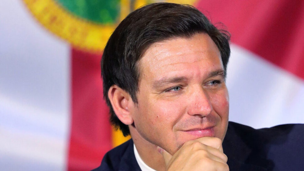Governor Ron DeSantis listens during a roundtable discussion with theme park leaders about safety protocols and the impact of the coronavirus pandemic, Wednesday, August 26, 2020. Executives from Walt Disney World, Universal Orlando and SeaWorld Orlando participated.