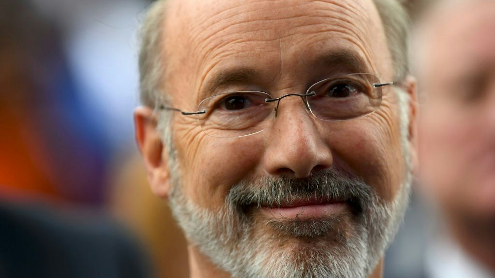 Pennsylvania Governor Tom Wolf reacts while listening to former President Barack Obama speak during a campaign rally for Wolf and Senator Bob Casey (D- PA) on September 21, 2018 in Philadelphia, Pennsylvania.