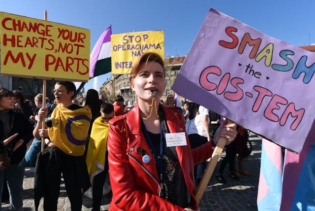 Protesters blow whistles during a transgender march in downtown Zagreb on March 30, 2019. - About 300 people, coming from all over the largely conservative Balkans region, took part in Croatia's first ever transgender march through downtown Zagreb. Organisers say they are sending clear messages of pride and defiance as well as against all forms of oppression. (Photo by Denis LOVROVIC / AFP) (Photo credit should read DENIS LOVROVIC/AFP via Getty Images)