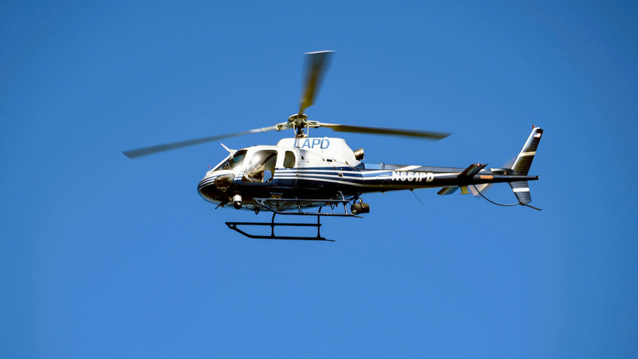 A Los Angeles Police Department helicopter seen flying over the LAPD Academy during a ceremony in honor of the 150th Anniversary of the LAPD in Los Angeles, California.
