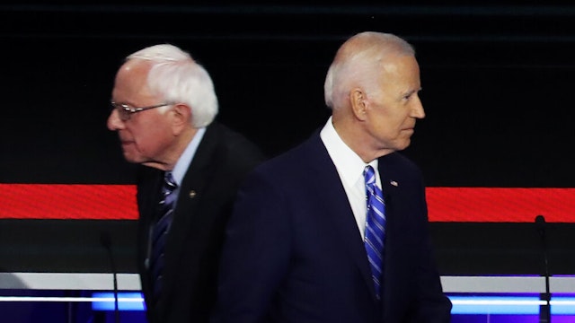 MIAMI, FLORIDA - JUNE 27: Democratic presidential candidates Sen. Bernie Sanders (L) (I-VT) and former Vice President Joe Biden pass each other on stage during the second night of the first Democratic presidential debate on June 27, 2019 in Miami, Florida. A field of 20 Democratic presidential candidates was split into two groups of 10 for the first debate of the 2020 election, taking place over two nights at Knight Concert Hall of the Adrienne Arsht Center for the Performing Arts of Miami-Dade County, hosted by NBC News, MSNBC, and Telemundo.