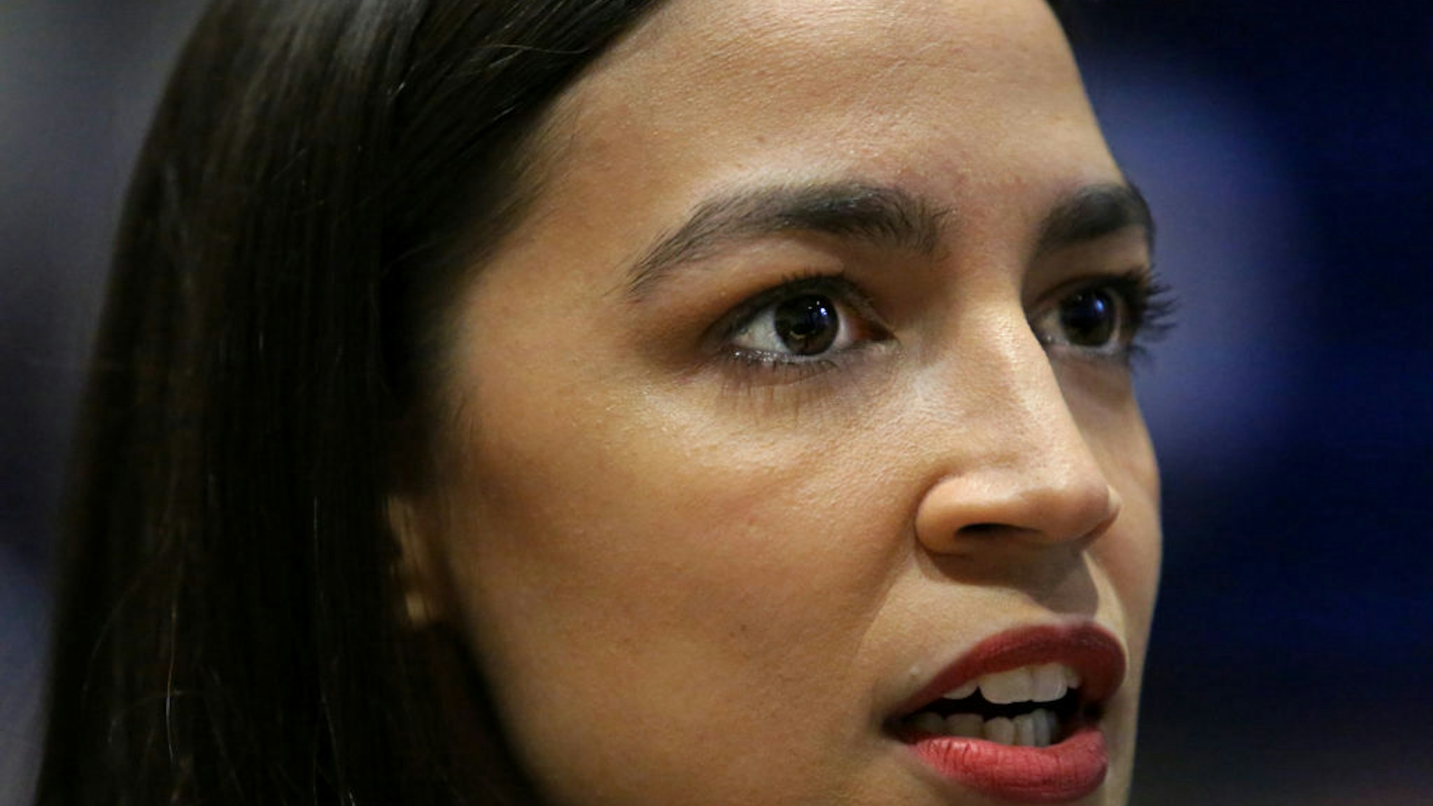 U.S. Rep. Alexandria Ocasio-Cortez (D-NY) speaks with members of the media before a Green New Deal For Public Housing Town Hall on December 14, 2019 in the Queens borough of New York City.
