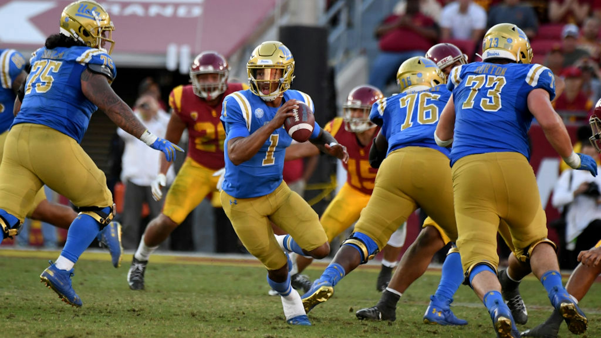 Quarterback Dorian Thompson-Robinson #1 of the UCLA Bruins prepares to pass against the USC Trojans in the second half of a NCAA football game at the Los Angeles Memorial Coliseum on Saturday, November 23, 2019 in Los Angeles, California.