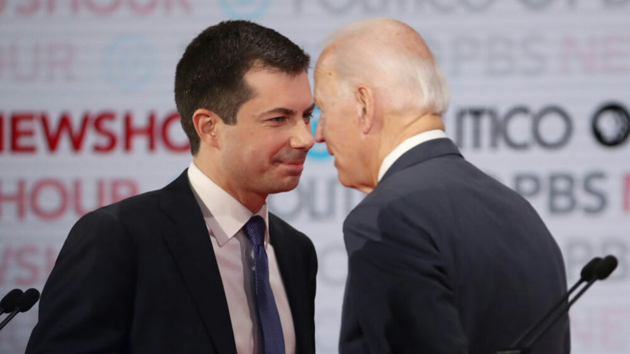 LOS ANGELES, CALIFORNIA - DECEMBER 19: Democratic presidential candidate South Bend, Indiana Mayor Pete Buttigieg (L) speaks with former Vice President Joe Biden during the Democratic presidential primary debate at Loyola Marymount University on December 19, 2019 in Los Angeles, California. Seven candidates out of the crowded field qualified for the 6th and last Democratic presidential primary debate of 2019 hosted by PBS NewsHour and Politico.