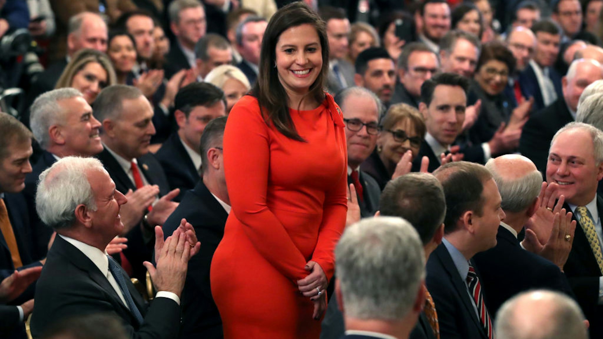 WASHINGTON, DC - FEBRUARY 06: Rep. Elise Stefanik (R-NY) (C) stands as she's acknowledged by U.S. President Donald Trump as he speaks one day after the U.S. Senate acquitted on two articles of impeachment, in the East Room of the White House February 6, 2020 in Washington, DC. After five months of congressional hearings and investigations about President Trump’s dealings with Ukraine, the U.S. Senate formally acquitted the president of charges that he abused his power and obstructed Congress. (Photo by Mark Wilson/Getty Images)