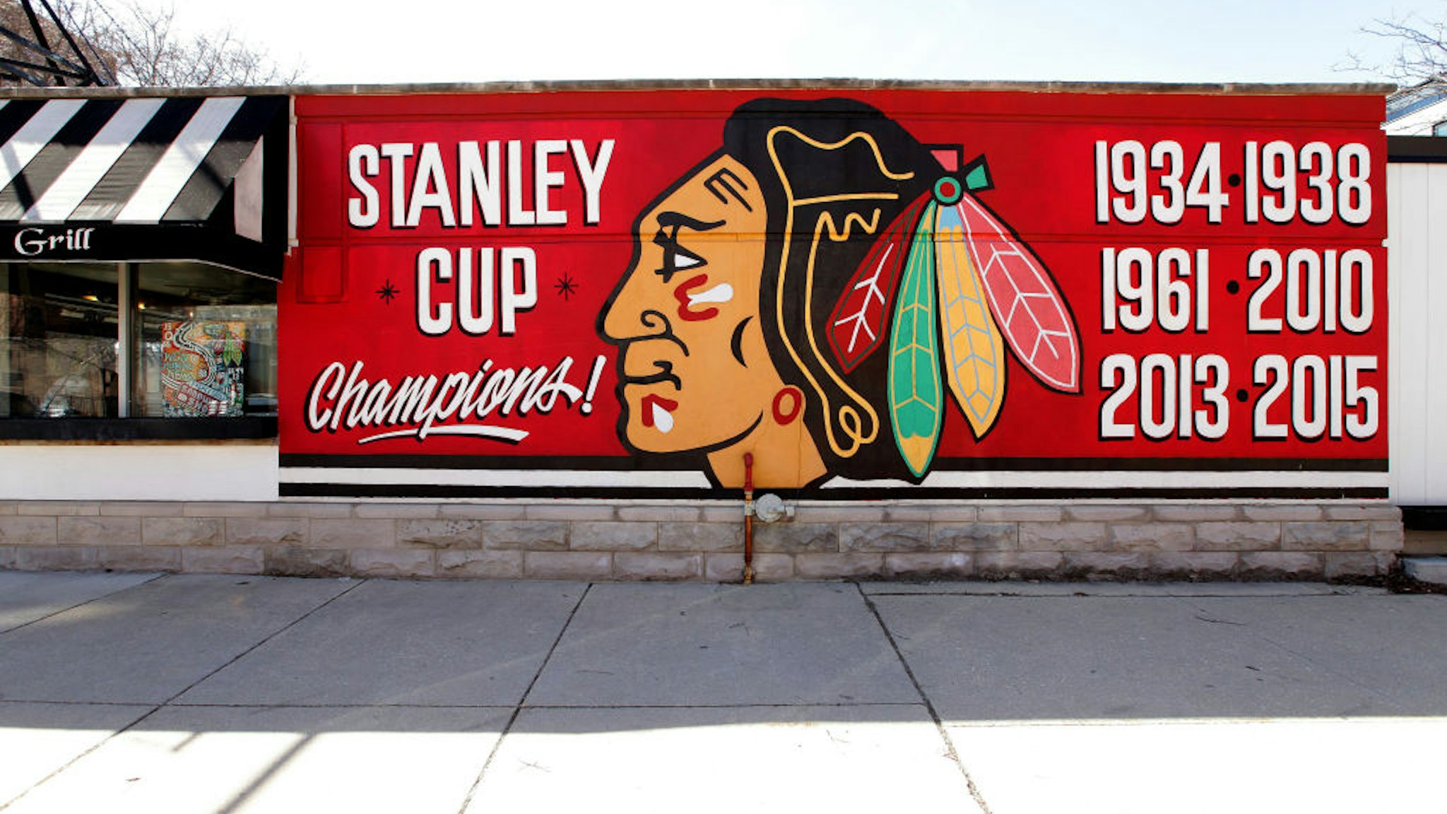 A Chicago Blackhawks 'Stanley Cup Champions' mural is displayed on the side of the Palace Grill Restaurant in Chicago, Illinois on March 7, 2020.