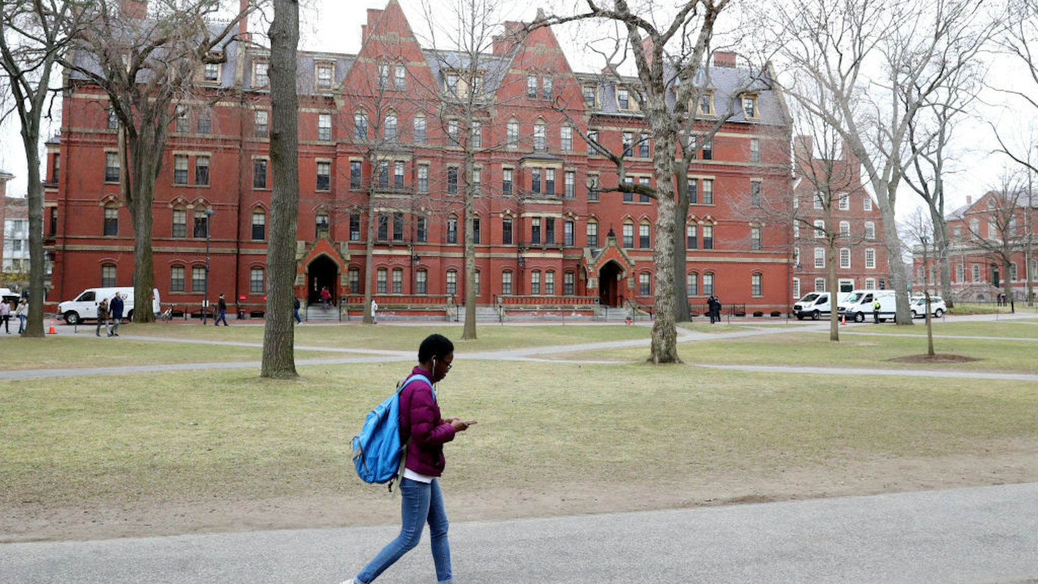 A student walks through Harvard Yard on the campus of Harvard University on March 12, 2020 in Cambridge, Massachusetts.