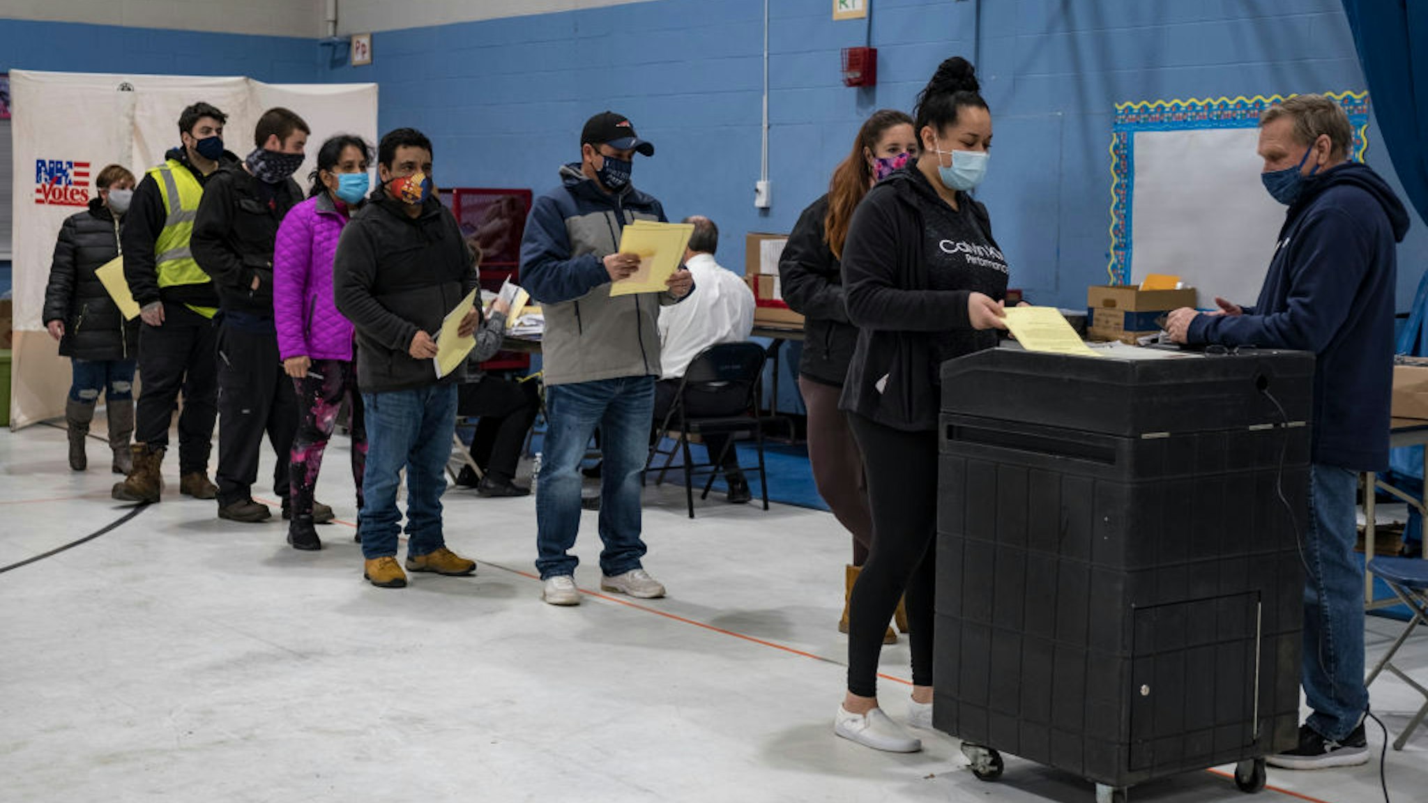 Voters lined up to cast their ballots at the Bishop Leo E. ONeil Youth Center Ward 9 polling place in Manchester, New Hampshire, one of the city's busiest, as Americans rushed to vote in the presidential election on November 3, 2020.