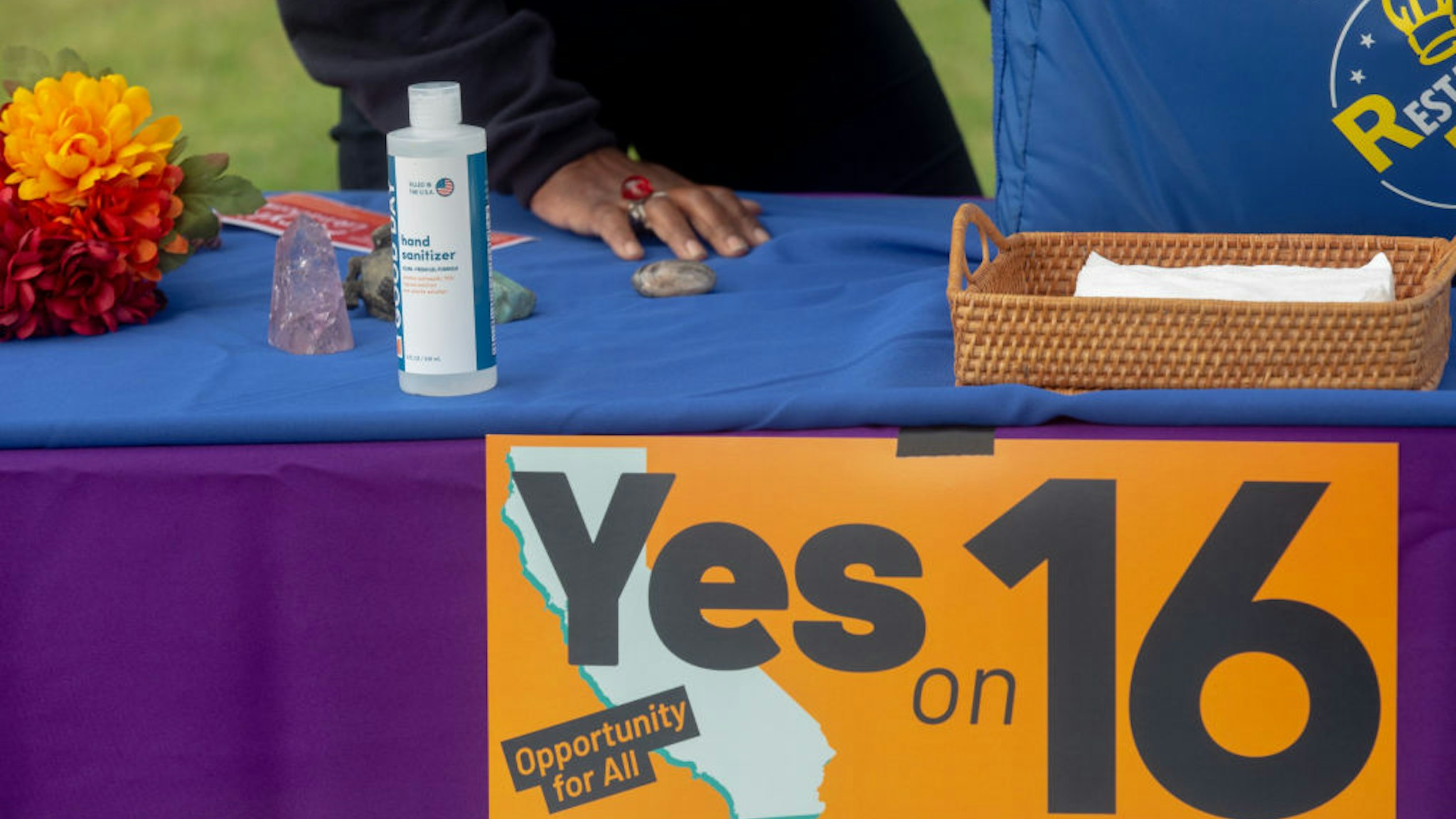 Supporters of Proposition 16 rally at Dorsey High School in Los Angeles to urge the community to vote yes on the proposition on Saturday, October 24, 2020, during early voting in California.