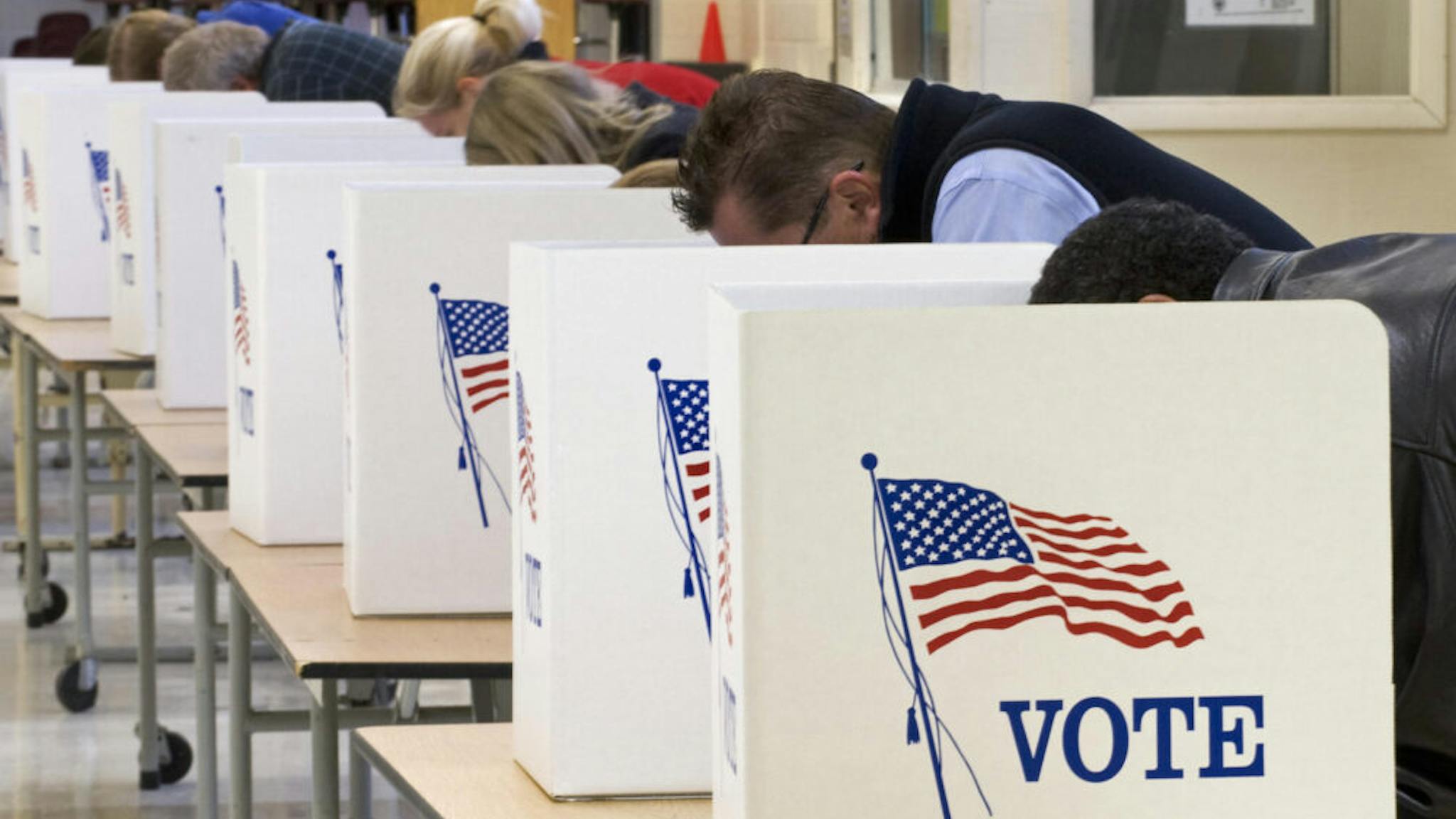 Voting Voters cast their ballots on Election Day November 04, 2008, at Centreville High School in Clifton, Virginia. Americans crowded polling stations Tuesday to vote in their historic election, with front-running Democrat Barack Obama seeking to become the first black US president and Republican rival John McCain battling for a comeback. AFP Photo/Paul J. Richards