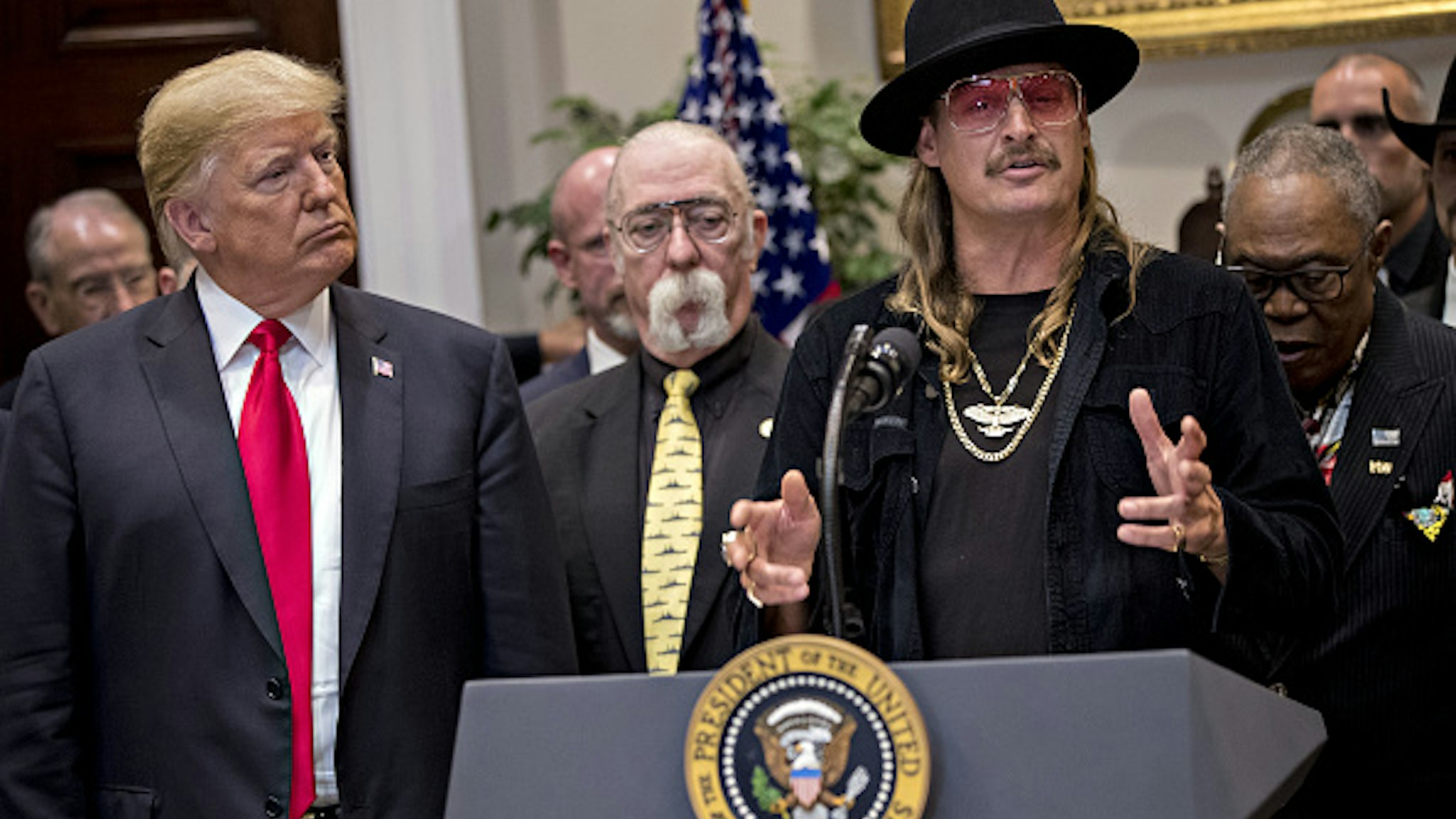 Musician Kid Rock, right, speaks as U.S. President Donald Trump, left, listens during a signing ceremony for H.R. 1551, the Hatch-Goodlatte Music Modernization Act, in the Roosevelt Room of the White House in Washington, D.C., U.S., on Thursday, Oct. 11, 2018. Trump on Wednesday said the "Fed has gone crazy" with interest-rate increases this year and doubled-down on Thursday, blaming the nation's "out of control" central bank for a sixth straight day of losses in U.S. equities. Still, he said, "I'm not going to fire him."