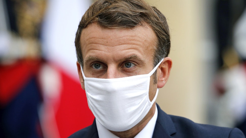 PARIS, FRANCE - OCTOBER 28: French President Emmanuel Macron wearing a protective face mask looks on as he makes a statement next to Estonian Prime Minister Juri Ratas following their meeting at the Elysee Palace on October 28, 2020 in Paris, France. Emmanuel Macron will speak this evening at 8 p.m. from the Elysee Palace, in an official speech to address the French to announce “difficult measures”. The President of the Republic and the government consider that faced with the sudden worsening of the Covid epidemic in France, containment measures are necessary.