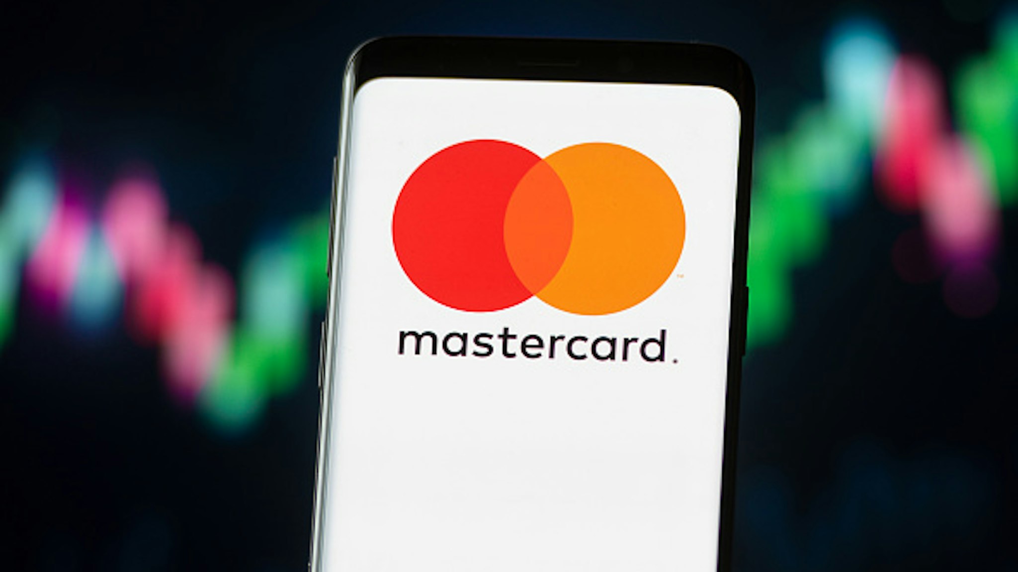 POLAND - 2020/11/04: In this photo illustration a Mastercard logo seen displayed on a smartphone.