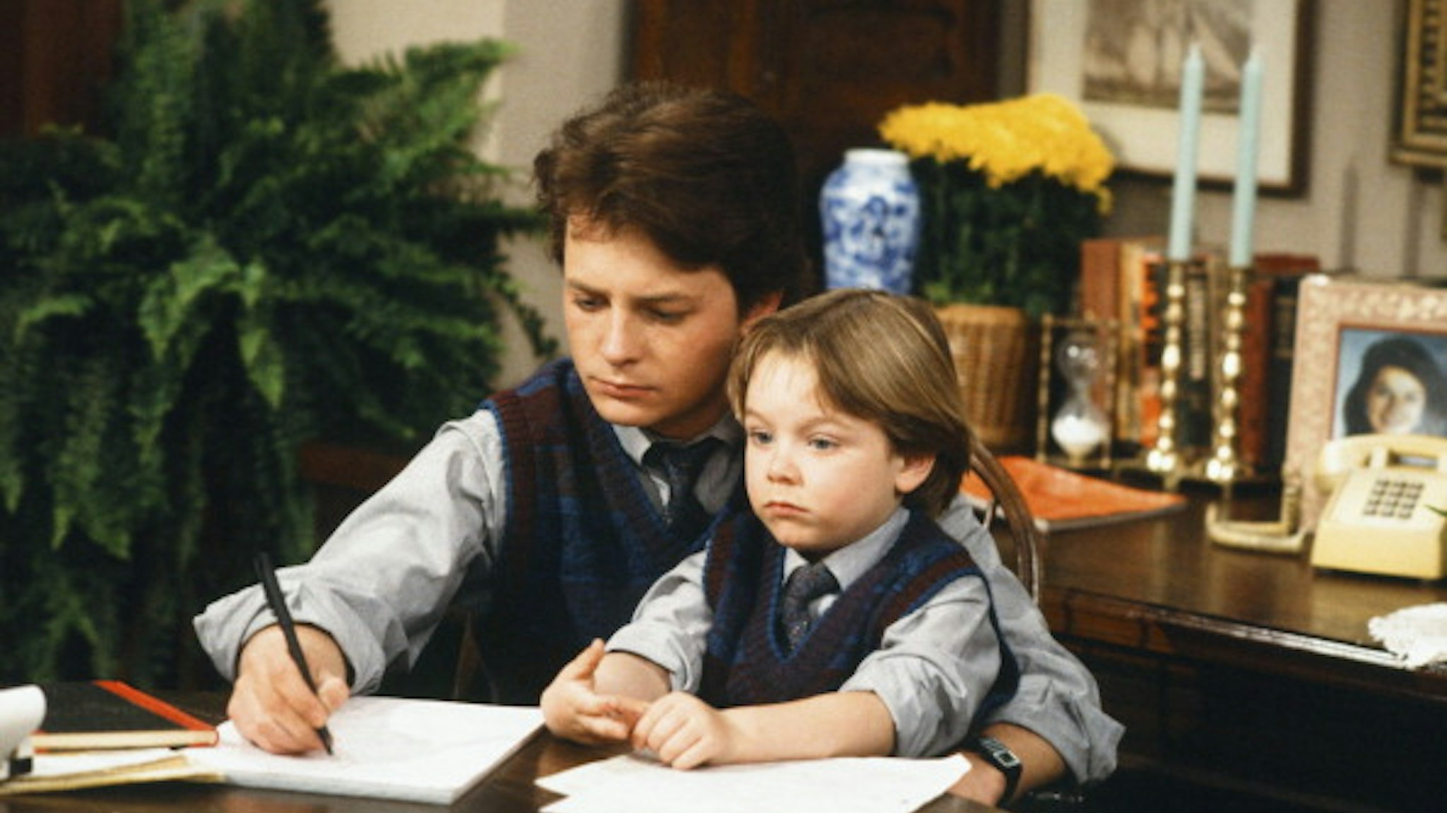 FAMILY TIES -- "'D' is for Date" Episode 25 -- Pictured: (l-r) Michael J. Fox as Alex P. Keaton, Brian Bonsall as Andrew 'Andy' Keaton