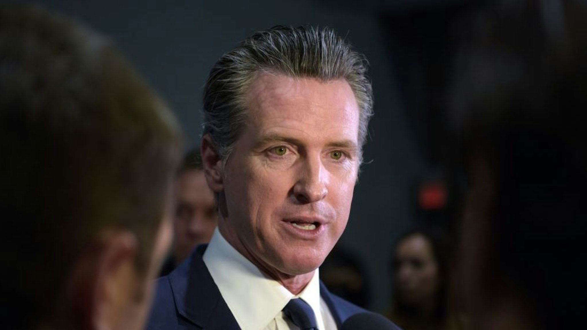 California Governor Gavin Newsom speaks to the press in the spin room after the sixth Democratic primary debate of the 2020 presidential campaign season co-hosted by PBS NewsHour &amp; Politico at Loyola Marymount University in Los Angeles, California on December 19, 2019.
