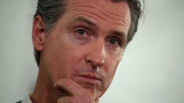 OAKLAND, CALIFORNIA - JANUARY 16: California Gov. Gavin Newsom looks on during a a news conference about the state's efforts on the homelessness crisis on January 16, 2020 in Oakland, California. Newsom was joined by Oakland Mayor Libby Schaaf to announce that Oakland will receive 15 unused FEMA trailers for the city to use as temporary housing and as mobile health and social services clinics for the homeless. Newsom signed on executive order on January 8 to deploy 100 trailers and crisis response teams to areas in need across the state.