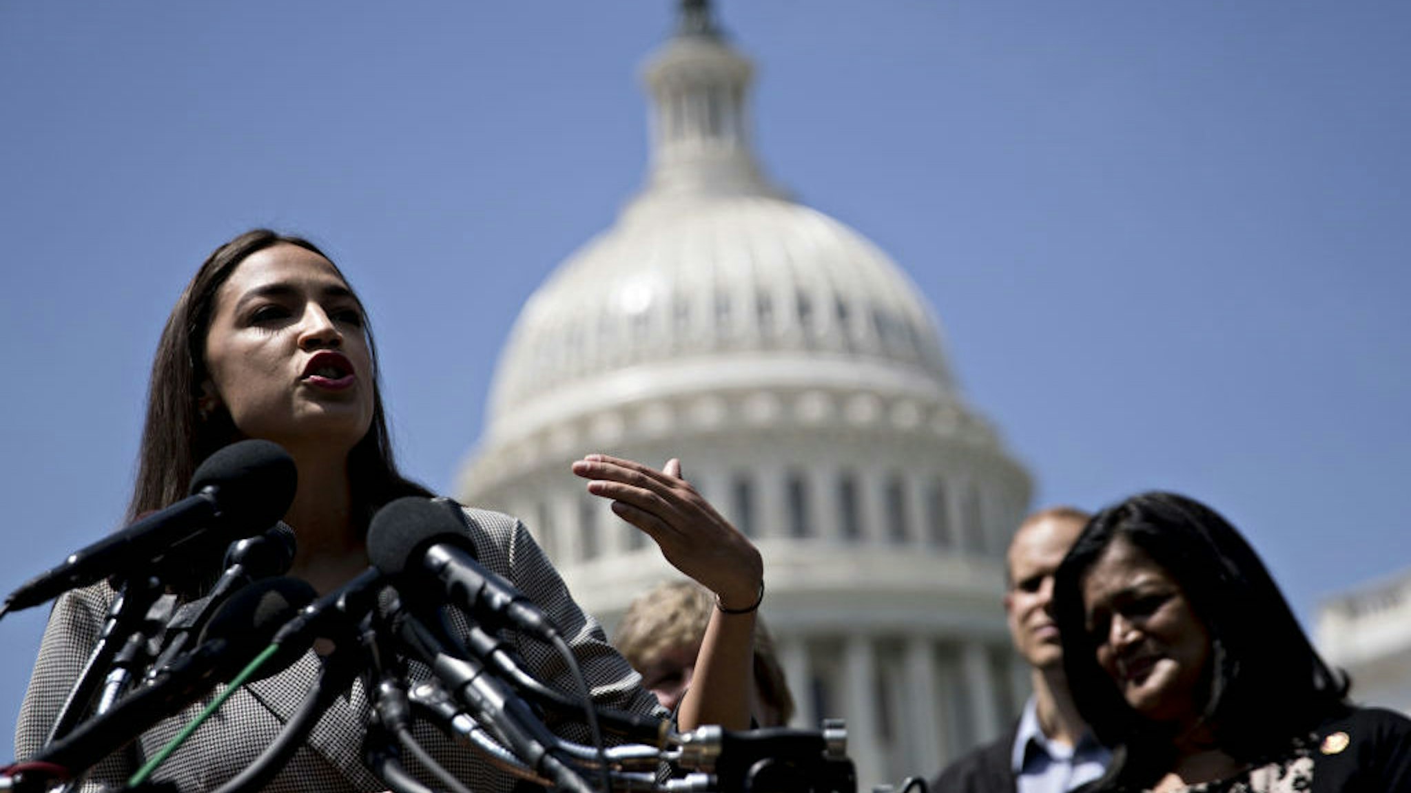 Representative Alexandria Ocasio-Cortez, a Democrat from New York, speaks during a news conference announcing college affordability legislation on Capitol Hill in Washington, D.C., U.S., on Monday, June 24, 2019. Democratic presidential hopeful Bernie Sanders is proposing to cancel the nation's outstanding $1.6 trillion of student debt and offsetting the cost with a tax on Wall Street transactions. Photographer: Andrew Harrer/Bloomberg