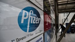 Pfizer A man entry at the building where Pfizer's office located in Thessaloniki on November 10, 2020. - Pfizer stock surged higher on November 9, 2020 prior to the opening of Wall Street trading after the company announced its vaccine is "90 percent effective" against Covid-19 infections. The news cheered markets worldwide, especially as coronavirus cases are spiking, forcing millions of people back into lockdown. (Photo by Sakis MITROLIDIS / AFP) (Photo by SAKIS MITROLIDIS/AFP via Getty Images)