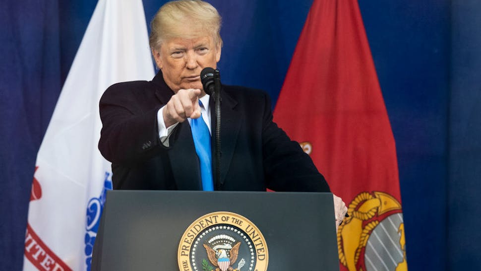 MANHATTAN, NY - NOVEMBER 11: The 45th President Donald J. Trump points to a serviceman while at the podium with the presidential seal during his address of the crowd for the opening ceremony of the 100th annual Veterans Day Parade. The Presidential Address was held in Madison Square Park in the Manhattan borough of New York on November 11, 2019, USA. (Photo by Ira L. Black/Corbis via Getty Images)