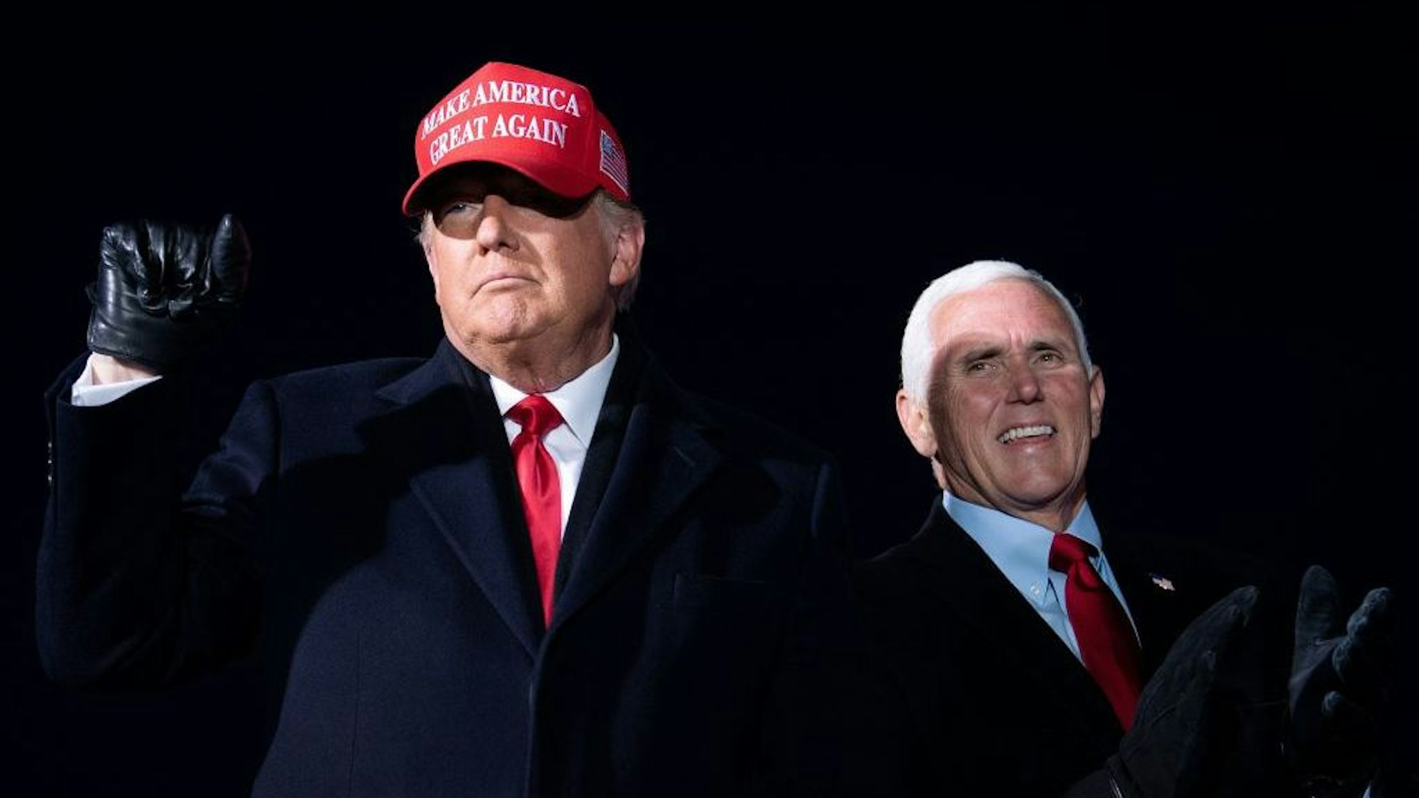 US President Donald Trump arrives with US Vice President Mike Pence for a Make America Great Again rally at Cherry Capital Airport in Traverse City, Michigan on November 2, 2020. (Photo by Brendan Smialowski / AFP) (Photo by BRENDAN SMIALOWSKI/AFP via Getty Images)
