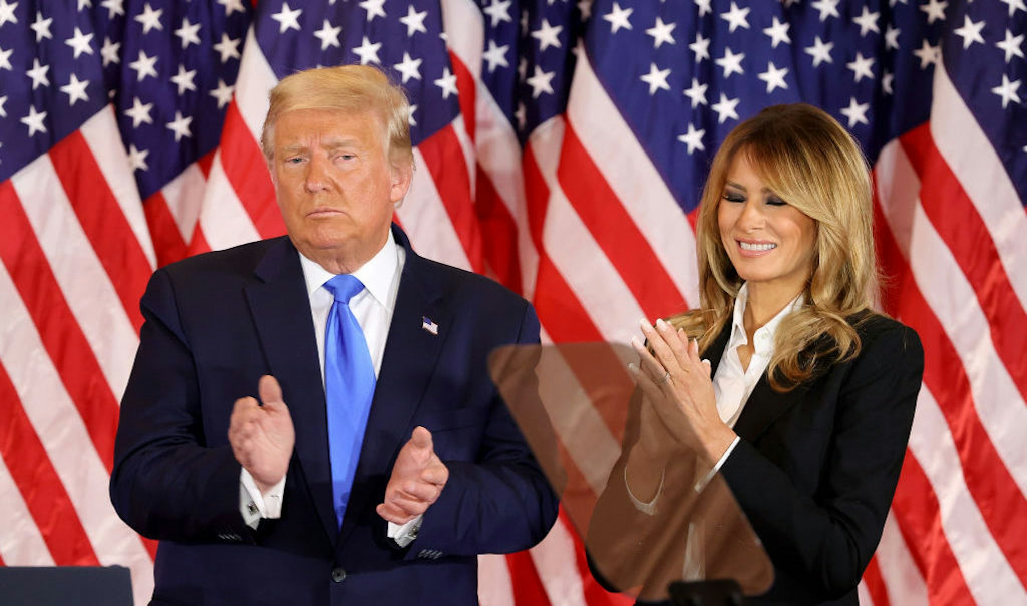 WASHINGTON, DC - NOVEMBER 04: U.S. President Donald Trump and first lady Melania Trump take the stage on election night in the East Room of the White House in the early morning hours of November 04, 2020 in Washington, DC. Trump spoke shortly after 2am with the presidential race against Democratic presidential nominee Joe Biden still too close to call. (Photo by Chip Somodevilla/Getty Images)