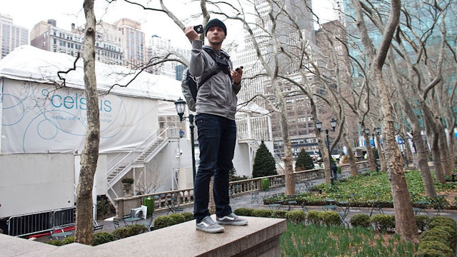 Tim Pool, an independent reporter uses his cell phone to broadcast live stream on the internet during a day of action with the Occupy Wall Street movement in New York, on Wednesday, February 29, 2012. (Photo by Ramin Talaie/Corbis via Getty Images)