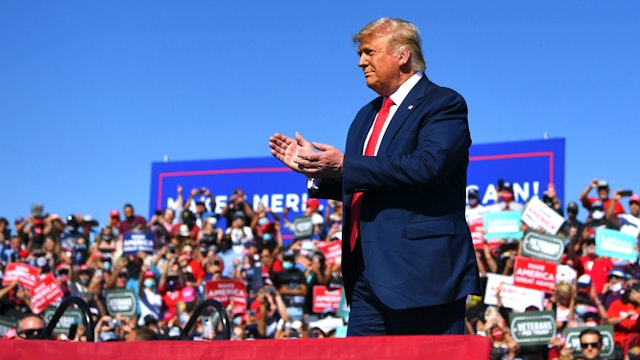 US President Donald Trump gestures on stage during a rally at Prescott Regional Airport in Prescott, Arizona on October 19, 2020. - US President Donald Trump went after top government scientist Anthony Fauci in a call with campaign staffers on October 19, 2020, suggesting the hugely respected and popular doctor was an "idiot."