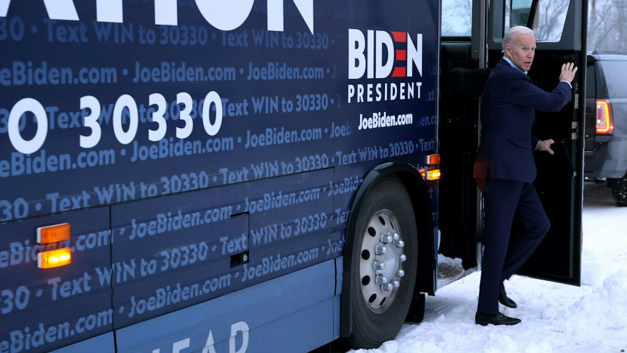 MARSHALLTOWN, IOWA - JANUARY 26: Democratic presidential candidate former Vice President Joe Biden steps off his campaign Bus before an event at the Central Iowa Fairgrounds January 26, 2020 in Marshalltown, Iowa. In a what appears to be a neck-and-neck race, Biden is ahead of rival candidate Sen. Bernie Sanders (I-VT) by 6 points in a USA Today/Suffolk University poll but is running behind Sanders by 8 points according to a New York Times/Siena College poll, both polls of likely Iowa caucus-goers conducted at about the same time. (Photo by