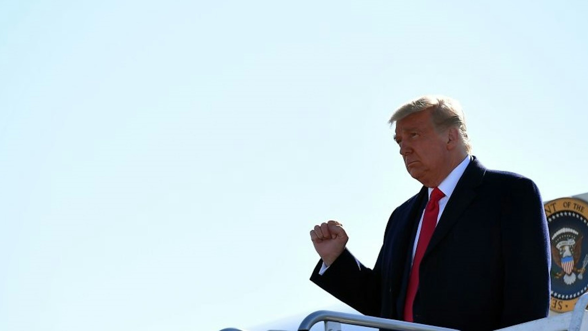 US President Donald Trump steps off Air Force One as he arrives at Trenton-Mercer Airport in Ewing Township, New Jersey, on October 31, 2020. - President Trump travels to Newtown, Pennsylvania, for a "Make America Great Again" rally. (Photo by MANDEL NGAN / AFP) (Photo by