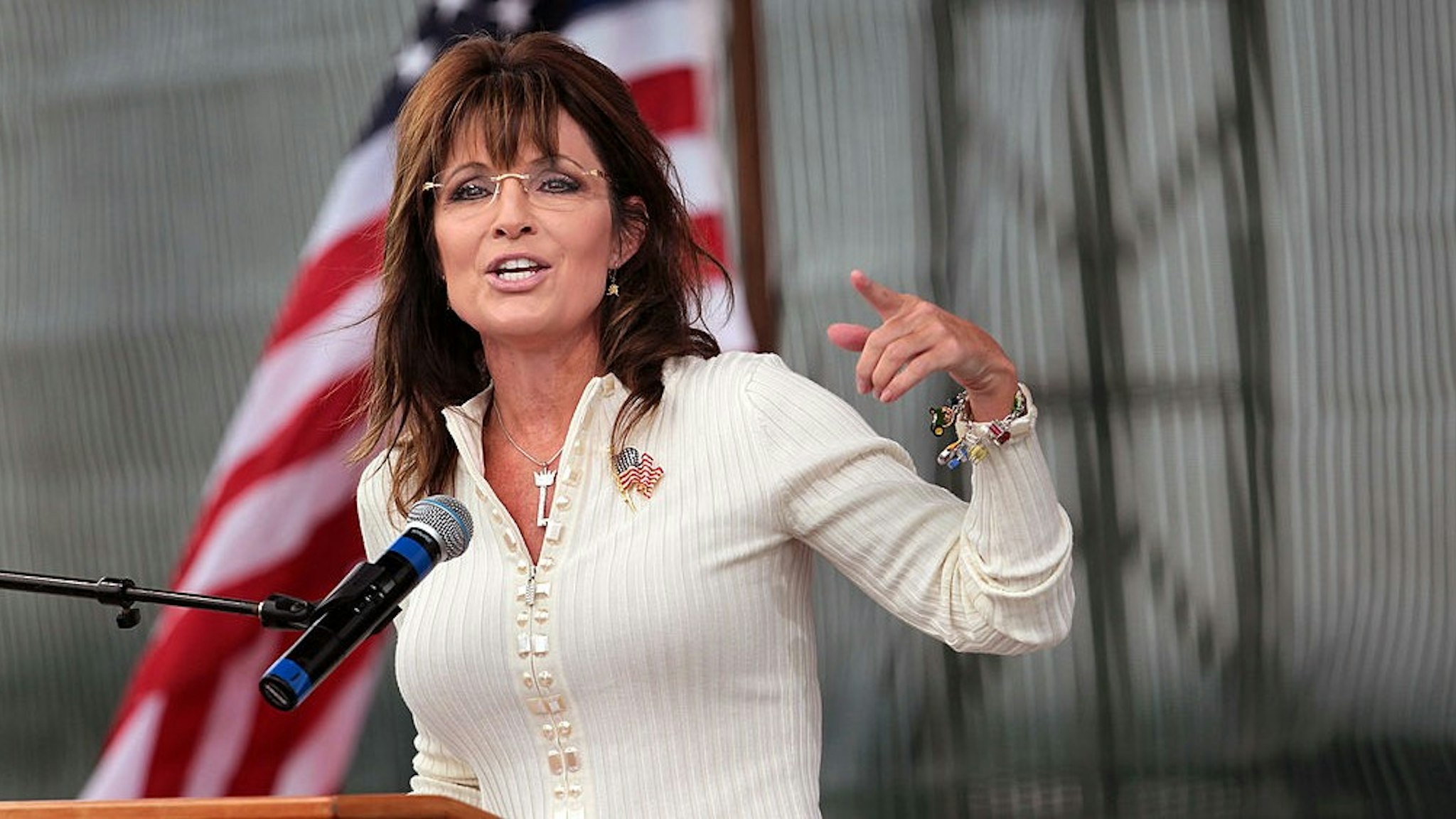INDIANOLA, IA - SEPTEMBER 03: Former Alaska Governor Sarah Palin speaks to supporters during the Tea Party of America's "Restoring America" event at the Indianola Balloon Festival Grounds September 3, 2011 in Indianola, Iowa. Yesterday Palin attended a Conservatives4Palin event. She is scheduled to speak at another Tea Party event in New Hampshire on Monday. The stops continue to fuel speculation that the former governor will run for president, a decision which she said she would make by the end of September. (Photo by