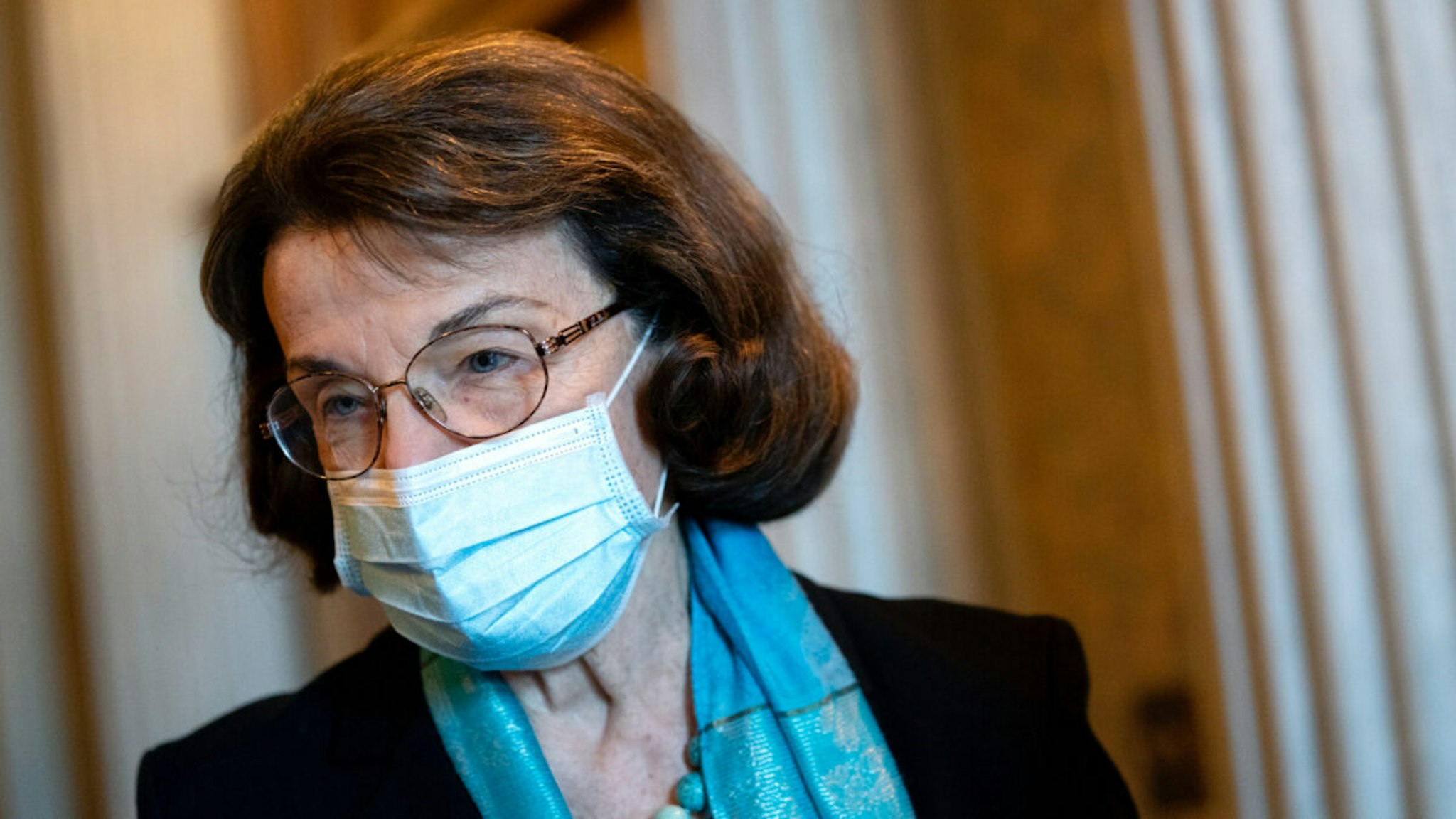 U.S. Sen. Dianne Feinstein (D-CA) wears a protective mask while departing the U.S. Capitol on December 11, 2020 in Washington, DC.