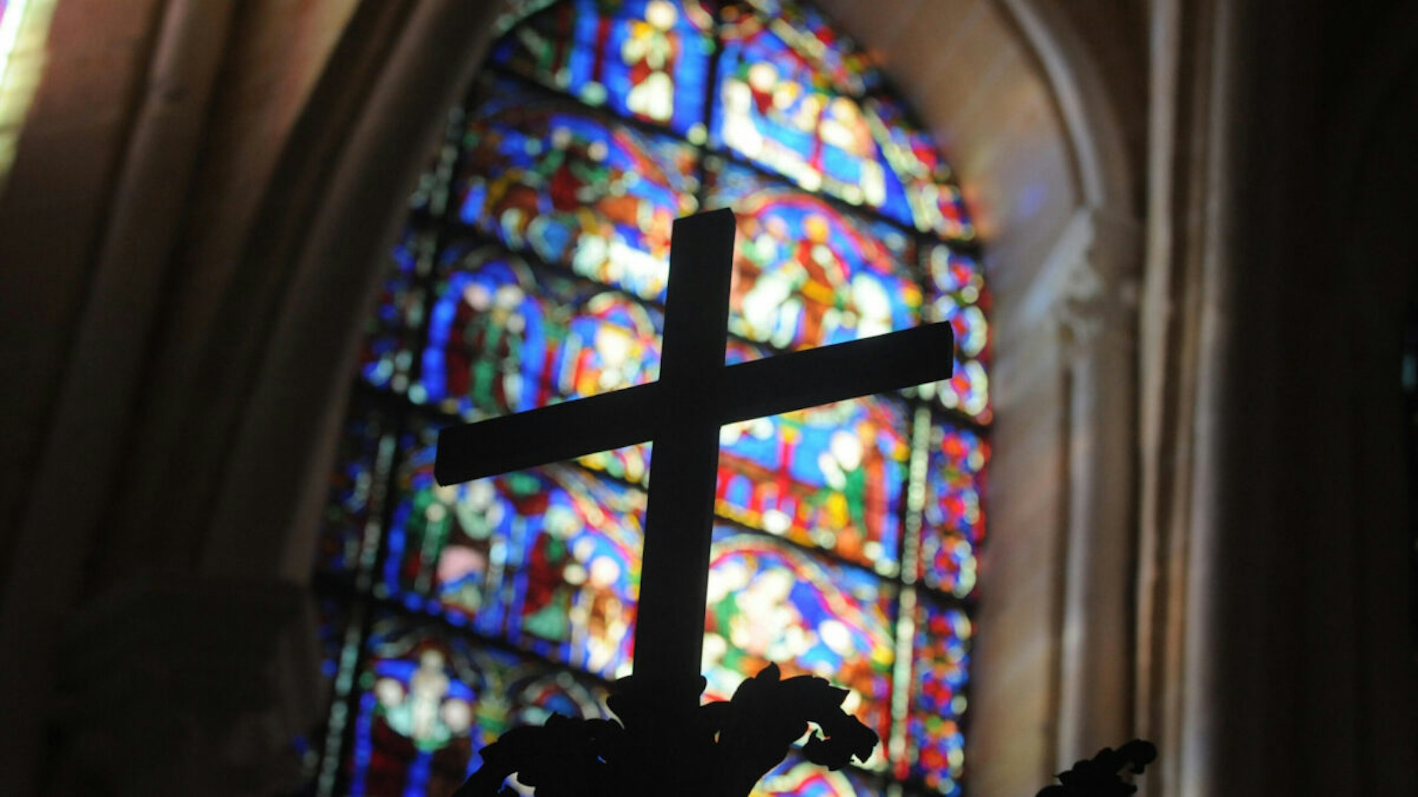 View taken on August 26, 2009 shows a cross and a stained glass in one of the restored chapels of the Cathedral of Chartres, 90 kilometers (55 miles) southwest of Paris.