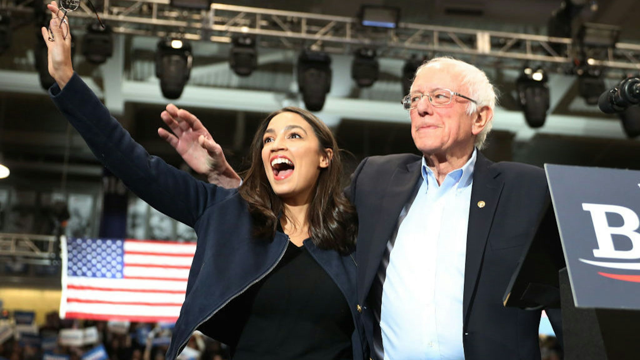 DURHAM, NEW HAMPSHIRE - FEBRUARY 10: U.S. Rep. Alexandria Ocasio-Cortez (D-N.Y) and Democratic presidential candidate Sen. Bernie Sanders (I-VT) stand together during his campaign event at the Whittemore Center Arena on February 10, 2020 in Durham, New Hampshire. The state's Democratic primary is tomorrow. (Photo by Joe Raedle/Getty Images)