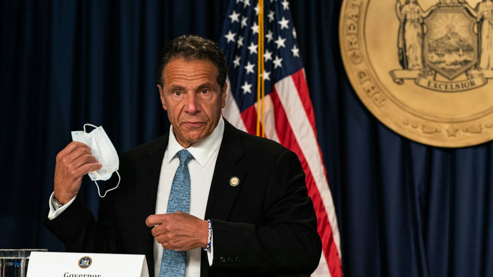 NEW YORK, NY - JULY 23: New York Gov. Andrew Cuomo takes off a protective mask during the daily media briefing at the Office of the Governor of the State of New York on July 23, 2020 in New York City. The Governor said the state liquor authority has suspended 27 bar and restaurant alcohol licenses for violations of social distancing rules as public officials try to keep the coronavirus outbreak under control. (Photo by Jeenah Moon/Getty Images)