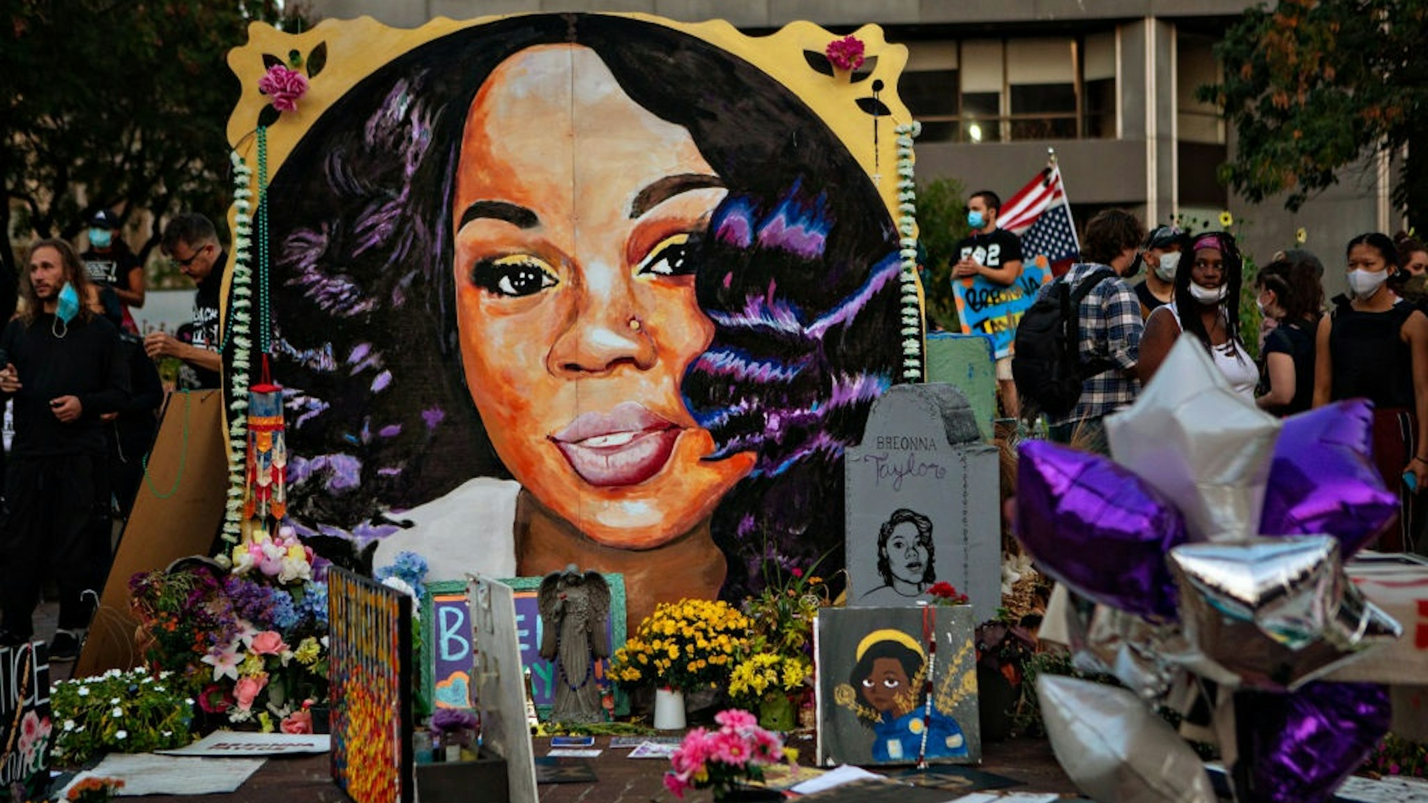 LOUISVILLE, KY - SEPTEMBER 26: People gather at Breonna Taylors make shift memorial in Injustice Square Park in downtown Louisville on Saturday, Sept. 26, 2020 in Louisville, KY.