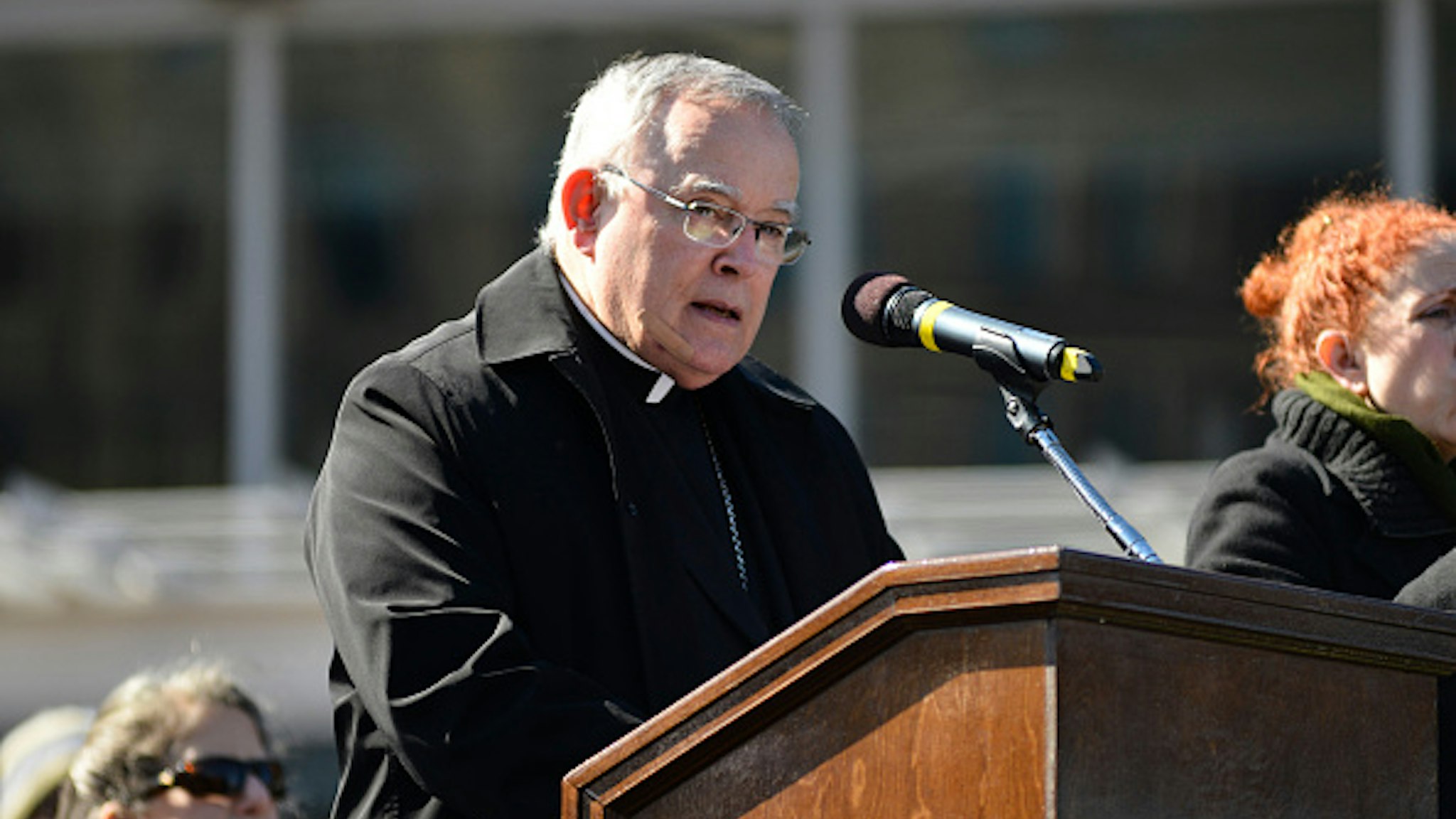 Archbishop Charles Chaput (left) is seen on stage as Interfaith Church and Community leaders are joined by local elected officials at a March 2, 2017 Stand Against Hate rally at Independence Mall in Philadelphia, PA.