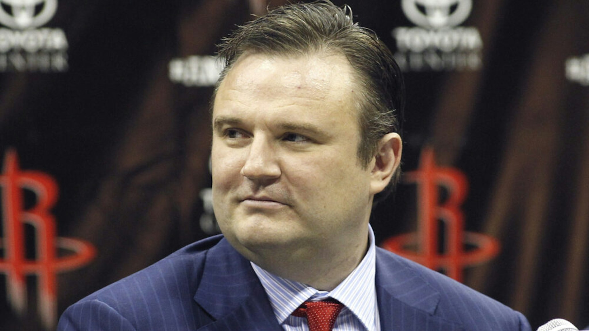 HOUSTON, TX - JULY 13: Houston Rockets general manager Daryl Morey listens as Dwight Howard is officially introduced as a Houston Rocket during a press conference on July 13, 2013 in Houston, Texas.